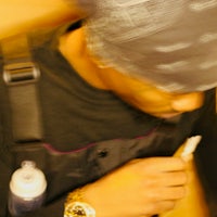 a man wearing a black hat